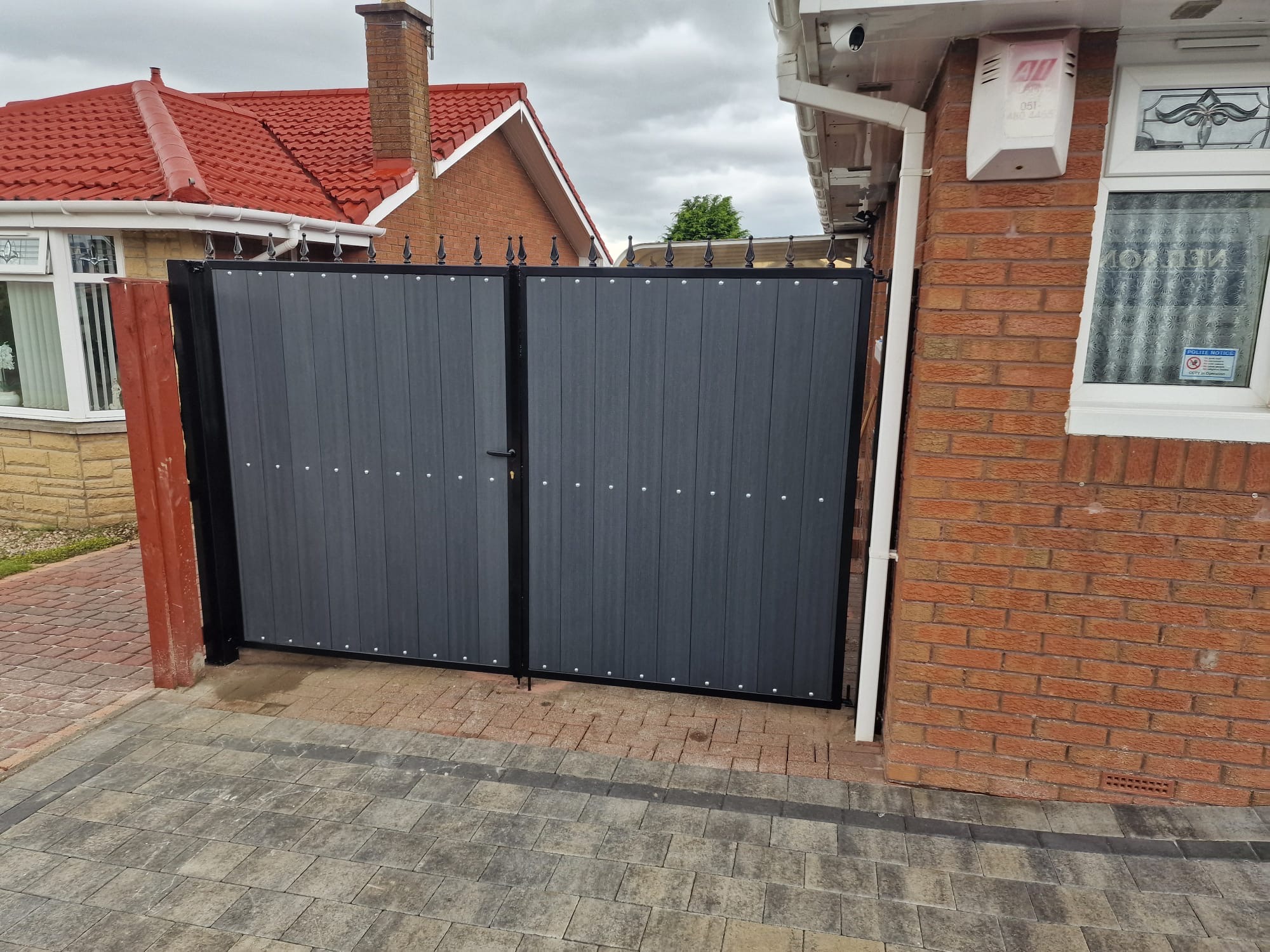 Black composite double driveway gates